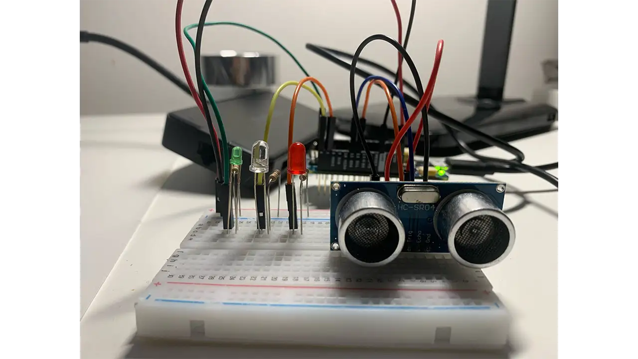Breadboard set up for the proximity detector, including the distance reader and lights.